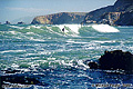 In this sixth photo in the Pacifica series you can see a lone surfer. You will notice that he is wearing a wet-suit due to the cold water along the coast of Northern California even in the middle of summer. In order to get pictures like this you must pay a price. Usually it is just the cost of film and the effort required to get out and take the shot. This time however it also cost me a price of a new cell phone. My phone must have dropped in the water because when I returned from taking these pictures my phone was gone and when I tired calling it, it was out of service even though it was switched on. Pacifica, CA. 'Nikon F100 35mm SLR' (Click for larger view)