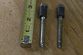 Bolts with plastic sleeves installed for bending aluminum rod (Click for larger view)