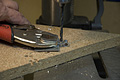 Step 4 of makeing a ground clamp - drilling the hole in the strap (Click for larger view)